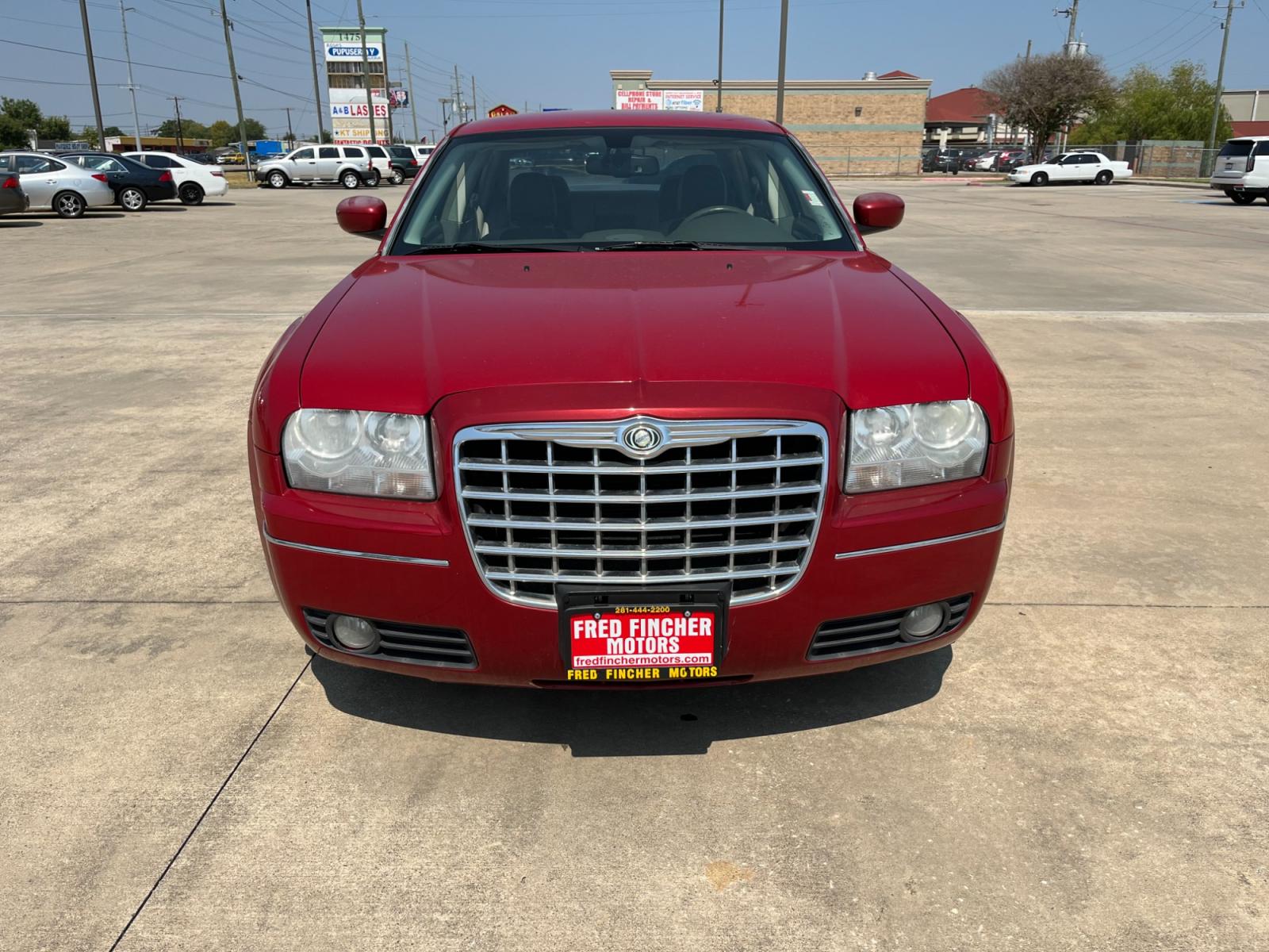 2008 red /TAN Chrysler 300 Touring (2C3LA53GX8H) with an 3.5L V6 DOHC 24V engine, 4-Speed Automatic Overdrive transmission, located at 14700 Tomball Parkway 249, Houston, TX, 77086, (281) 444-2200, 29.928619, -95.504074 - Photo #1