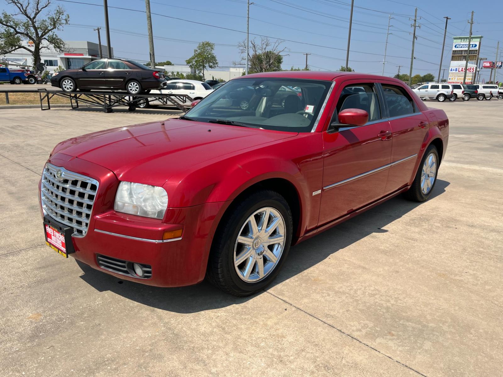 2008 red /TAN Chrysler 300 Touring (2C3LA53GX8H) with an 3.5L V6 DOHC 24V engine, 4-Speed Automatic Overdrive transmission, located at 14700 Tomball Parkway 249, Houston, TX, 77086, (281) 444-2200, 29.928619, -95.504074 - Photo #2