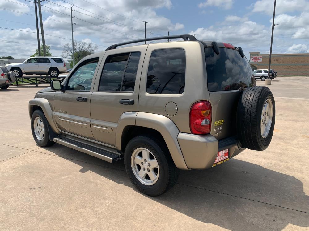 2003 gold /tan Jeep Liberty Limited 4WD (1J4GL58K73W) with an 3.7L V6 SOHC 12V engine, 4-Speed Automatic Overdrive transmission, located at 14700 Tomball Parkway 249, Houston, TX, 77086, (281) 444-2200, 29.928619, -95.504074 - Photo #0