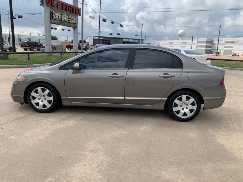 2006 SILVER /TAN Honda Civic LX Sedan AT (1HGFA16516L) with an 1.8L L4 SOHC 16V engine, 5-Speed Automatic Overdrive transmission, located at 14700 Tomball Parkway 249, Houston, TX, 77086, (281) 444-2200, 29.928619, -95.504074 - Photo #3