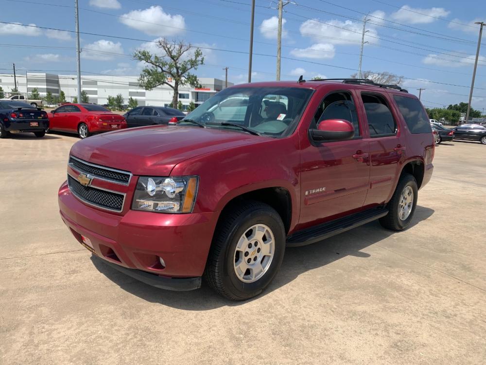 2007 red Chevrolet Tahoe LS 4WD (1GNFK13027J) with an 5.3L V8 OHV 16V FFV engine, 4-Speed Automatic Overdrive transmission, located at 14700 Tomball Parkway 249, Houston, TX, 77086, (281) 444-2200, 29.928619, -95.504074 - Photo #2