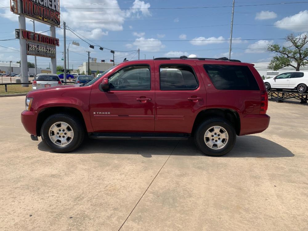 2007 red Chevrolet Tahoe LS 4WD (1GNFK13027J) with an 5.3L V8 OHV 16V FFV engine, 4-Speed Automatic Overdrive transmission, located at 14700 Tomball Parkway 249, Houston, TX, 77086, (281) 444-2200, 29.928619, -95.504074 - Photo #3