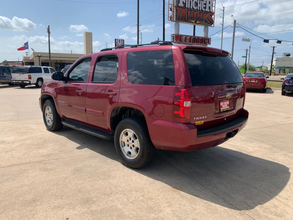 2007 red Chevrolet Tahoe LS 4WD (1GNFK13027J) with an 5.3L V8 OHV 16V FFV engine, 4-Speed Automatic Overdrive transmission, located at 14700 Tomball Parkway 249, Houston, TX, 77086, (281) 444-2200, 29.928619, -95.504074 - Photo #4