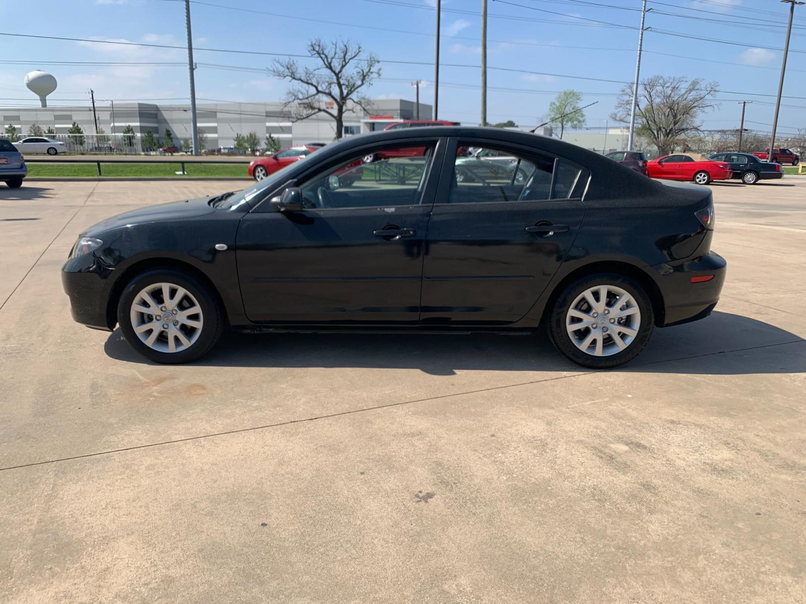 2008 Black /black Mazda MAZDA3 i Sport 4-Door (JM1BK32FX81) with an 2.0L L4 DOHC 16V engine, Automatic transmission, located at 14700 Tomball Parkway 249, Houston, TX, 77086, (281) 444-2200, 29.928619, -95.504074 - Photo #3