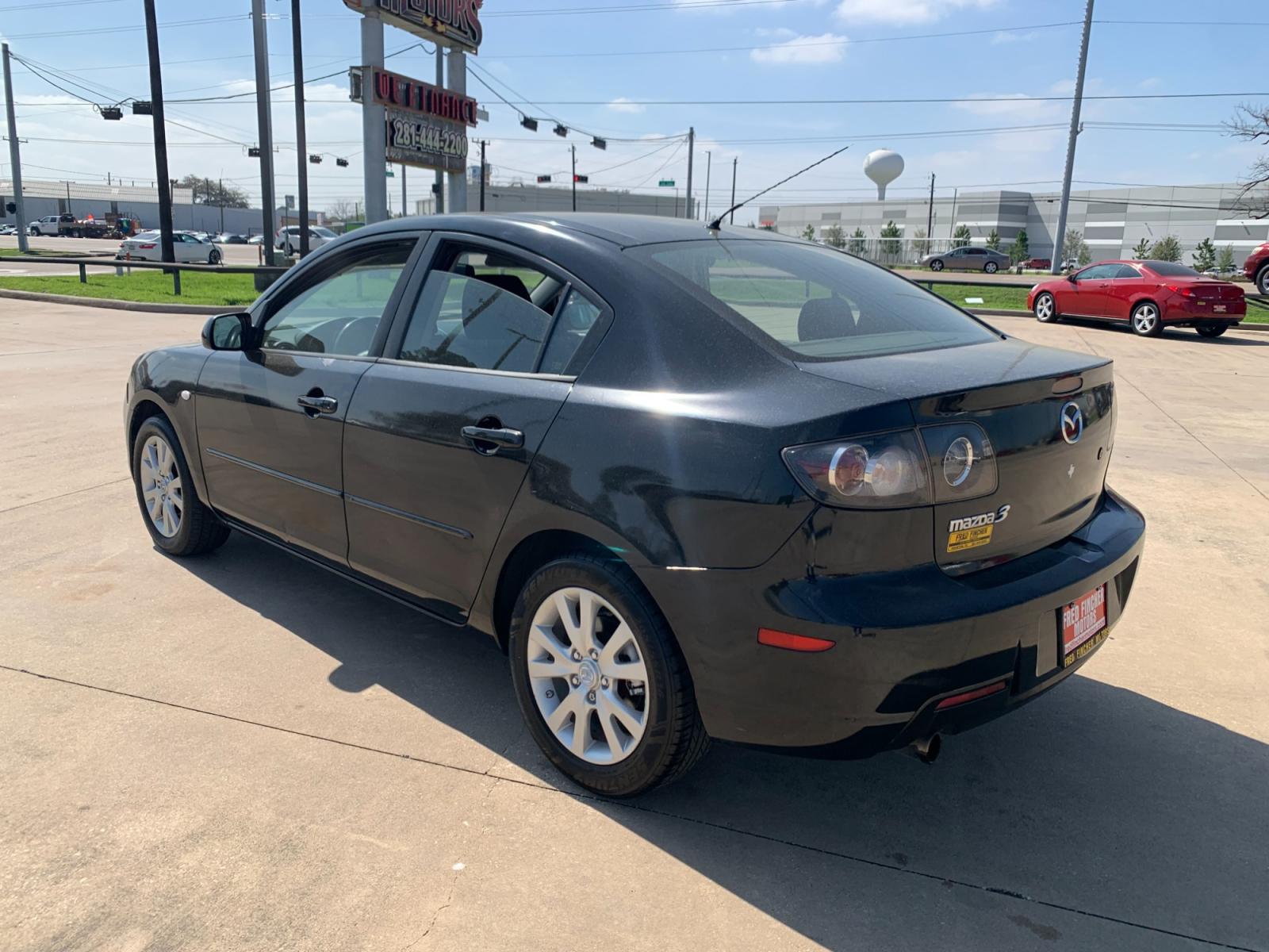 2008 Black /black Mazda MAZDA3 i Sport 4-Door (JM1BK32FX81) with an 2.0L L4 DOHC 16V engine, Automatic transmission, located at 14700 Tomball Parkway 249, Houston, TX, 77086, (281) 444-2200, 29.928619, -95.504074 - Photo #4