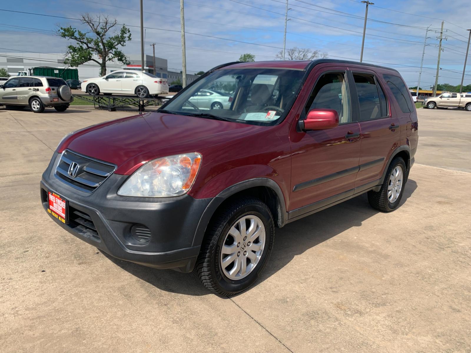 2005 red Honda CR-V EX 4WD AT (JHLRD78855C) with an 2.4L L4 DOHC 16V engine, 5-Speed Automatic Overdrive transmission, located at 14700 Tomball Parkway 249, Houston, TX, 77086, (281) 444-2200, 29.928619, -95.504074 - Photo #2