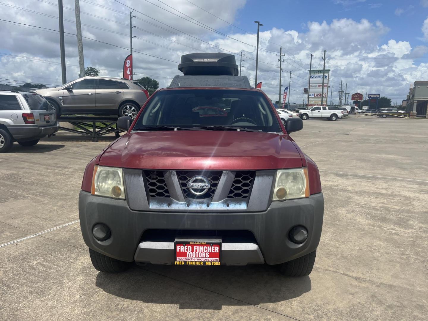 2007 red /black Nissan Xterra S 2WD (5N1AN08U07C) with an 4.0L V6 DOHC 24V engine, Automatic transmission, located at 14700 Tomball Parkway 249, Houston, TX, 77086, (281) 444-2200, 29.928619, -95.504074 - Photo#1