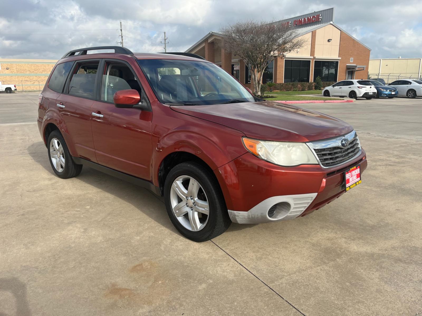 2010 orange /black Subaru Forester 2.5X Premium (JF2SH6CCXAH) with an 2.5L H4 SOHC 16V engine, 4-Speed Automatic transmission, located at 14700 Tomball Parkway 249, Houston, TX, 77086, (281) 444-2200, 29.928619, -95.504074 - Photo #0