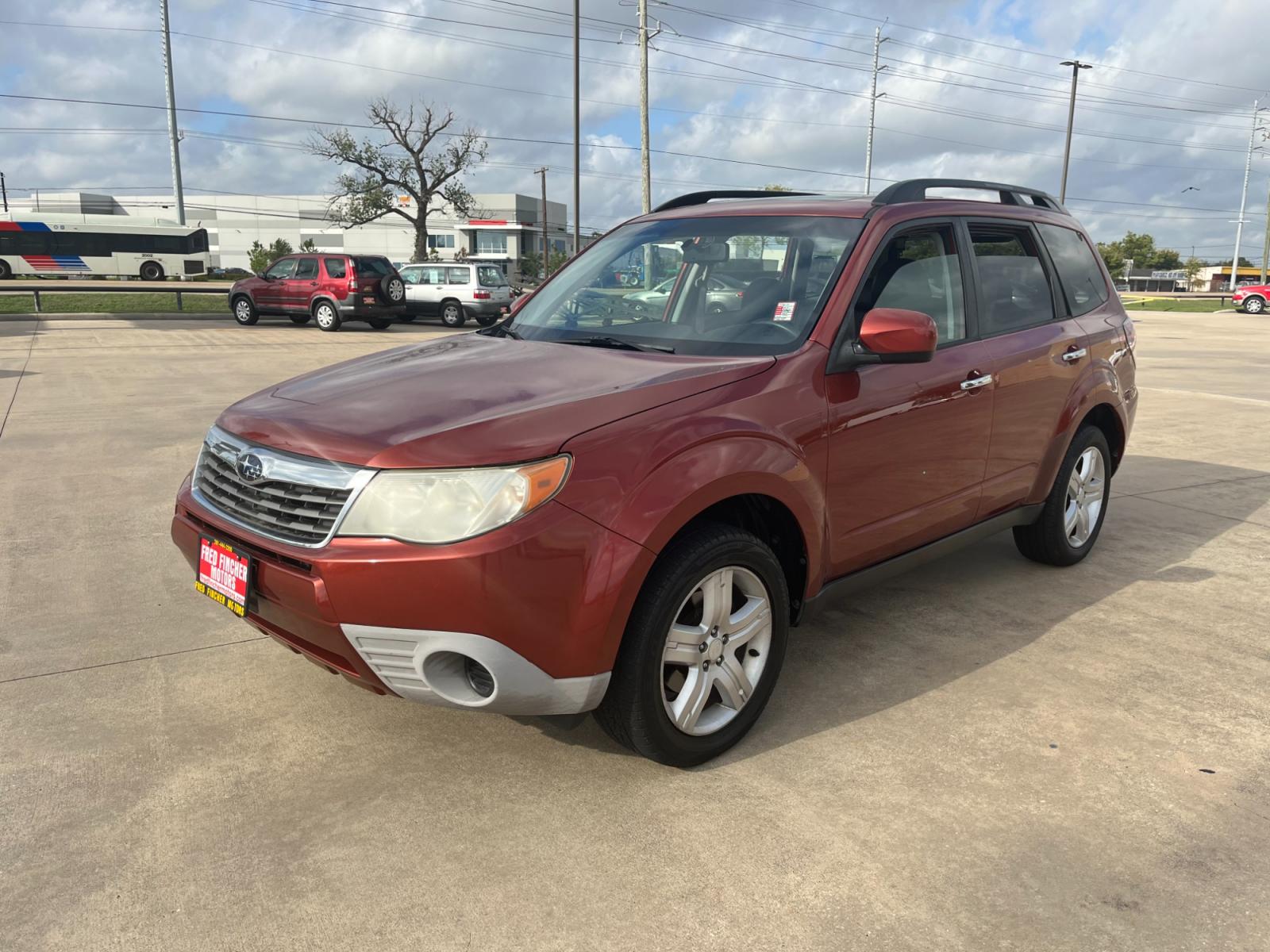 2010 orange /black Subaru Forester 2.5X Premium (JF2SH6CCXAH) with an 2.5L H4 SOHC 16V engine, 4-Speed Automatic transmission, located at 14700 Tomball Parkway 249, Houston, TX, 77086, (281) 444-2200, 29.928619, -95.504074 - Photo #2