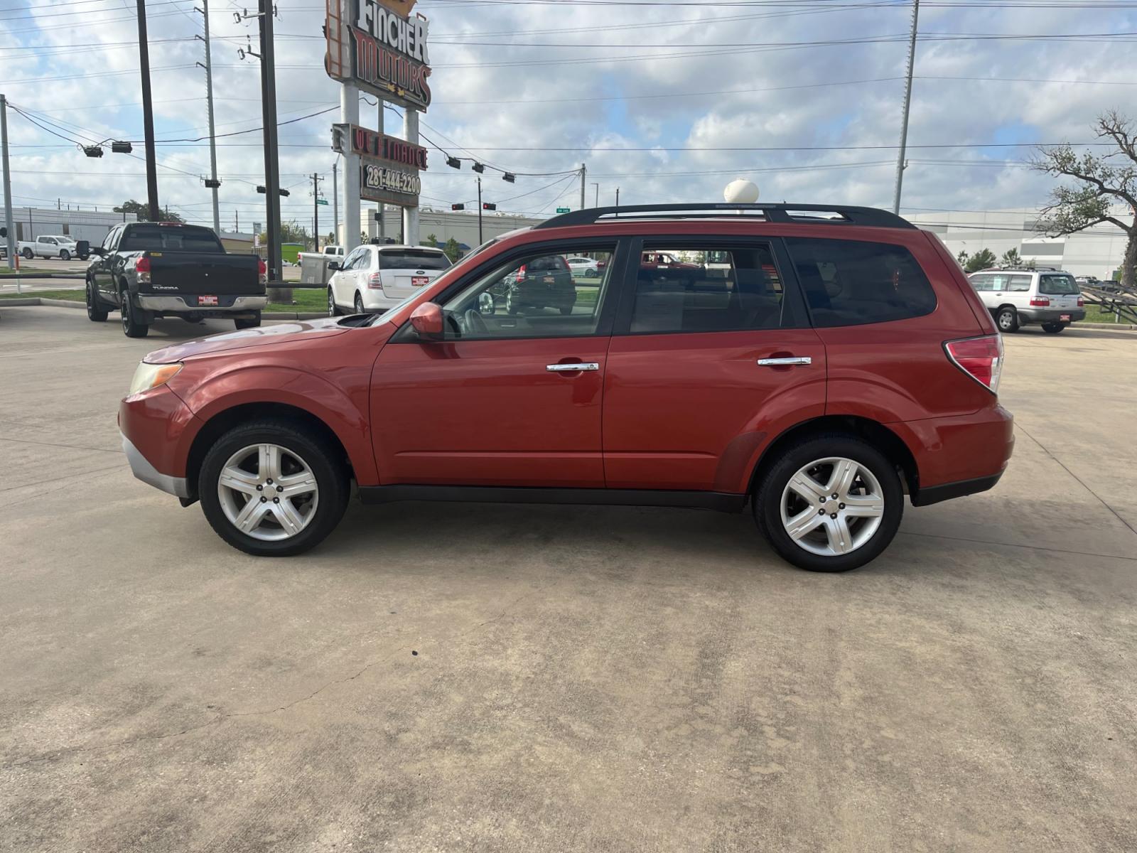 2010 orange /black Subaru Forester 2.5X Premium (JF2SH6CCXAH) with an 2.5L H4 SOHC 16V engine, 4-Speed Automatic transmission, located at 14700 Tomball Parkway 249, Houston, TX, 77086, (281) 444-2200, 29.928619, -95.504074 - Photo #3