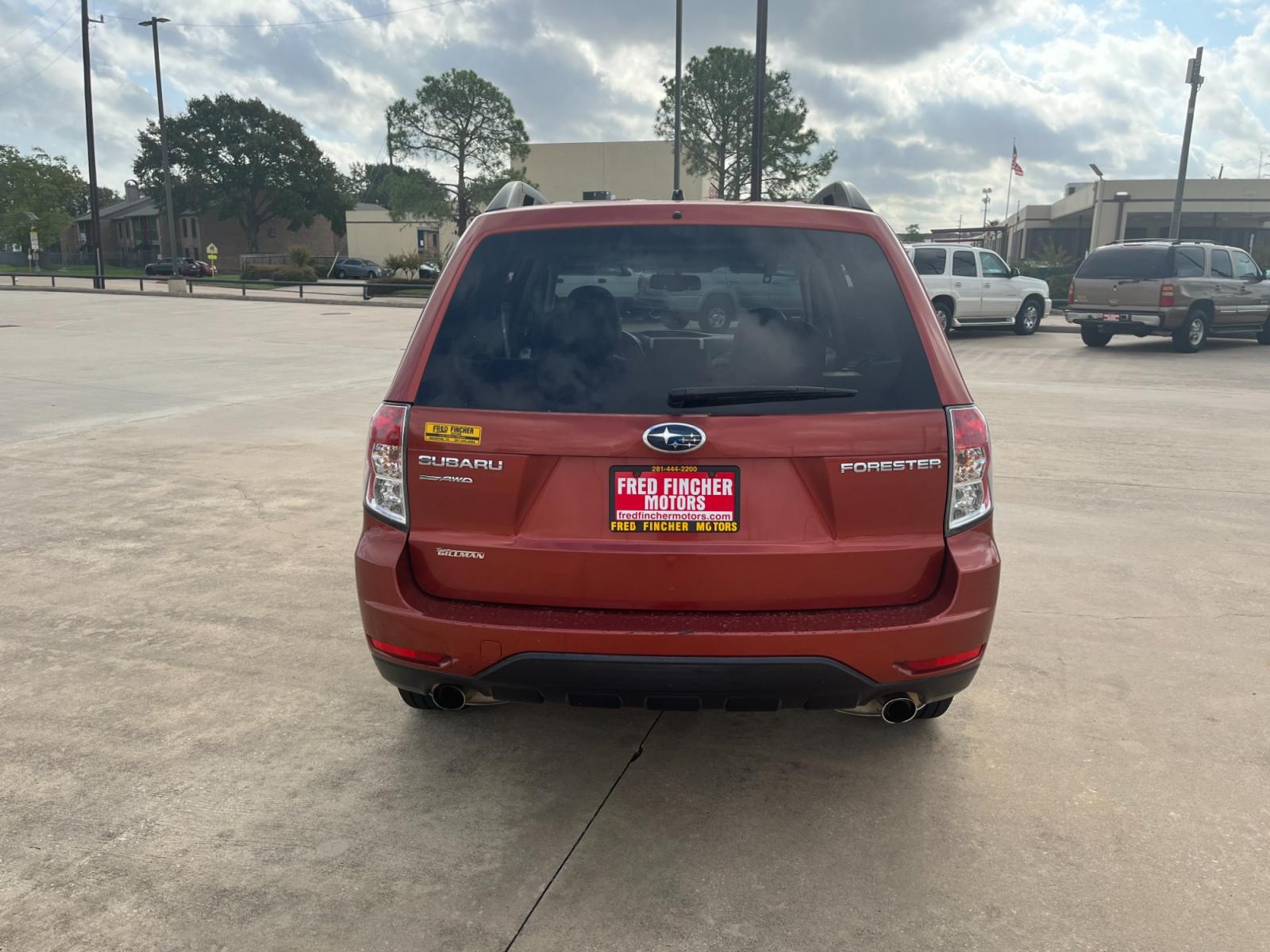 2010 orange /black Subaru Forester 2.5X Premium (JF2SH6CCXAH) with an 2.5L H4 SOHC 16V engine, 4-Speed Automatic transmission, located at 14700 Tomball Parkway 249, Houston, TX, 77086, (281) 444-2200, 29.928619, -95.504074 - Photo #5