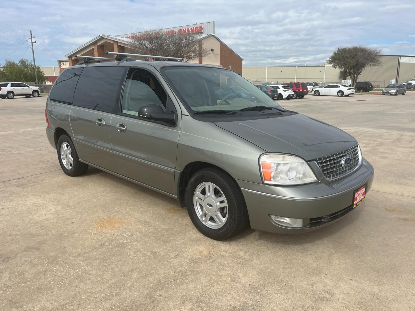 2004 green /TAN Ford Freestar SEL (2FMZA52264B) with an 4.2L V6 OHV 12V engine, 4-Speed Automatic Overdrive transmission, located at 14700 Tomball Parkway 249, Houston, TX, 77086, (281) 444-2200, 29.928619, -95.504074 - Photo #0