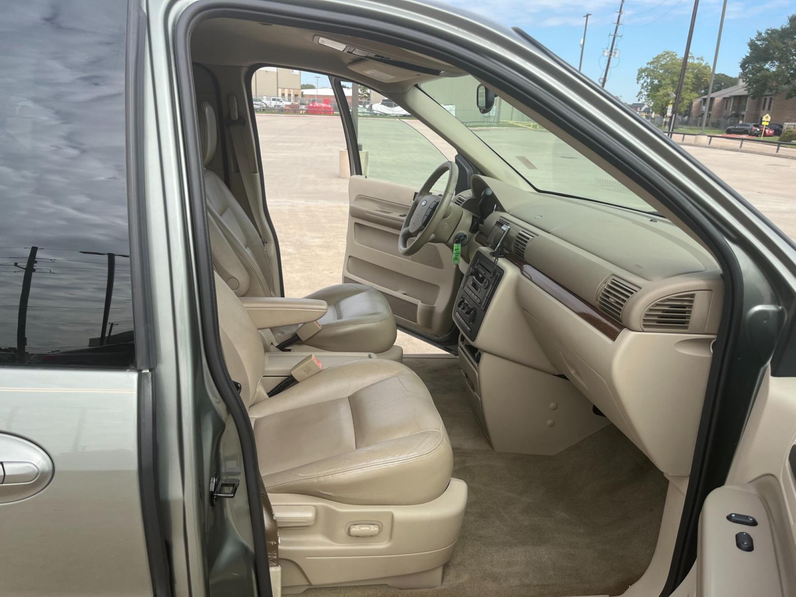 2004 green /TAN Ford Freestar SEL (2FMZA52264B) with an 4.2L V6 OHV 12V engine, 4-Speed Automatic Overdrive transmission, located at 14700 Tomball Parkway 249, Houston, TX, 77086, (281) 444-2200, 29.928619, -95.504074 - Photo #9