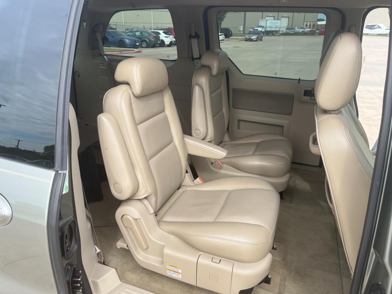 2004 green /TAN Ford Freestar SEL (2FMZA52264B) with an 4.2L V6 OHV 12V engine, 4-Speed Automatic Overdrive transmission, located at 14700 Tomball Parkway 249, Houston, TX, 77086, (281) 444-2200, 29.928619, -95.504074 - Photo #10
