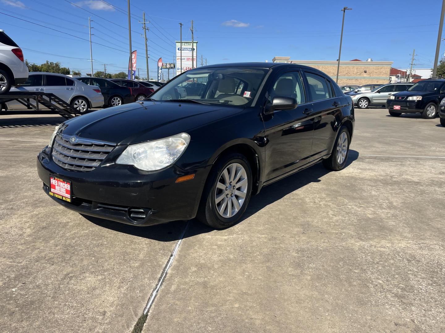 2010 Black /TAN Chrysler Sebring Sedan Limited (1C3CC5FB2AN) with an 2.4L L4 DOHC 16V engine, 4-Speed Automatic transmission, located at 14700 Tomball Parkway 249, Houston, TX, 77086, (281) 444-2200, 29.928619, -95.504074 - Photo#2