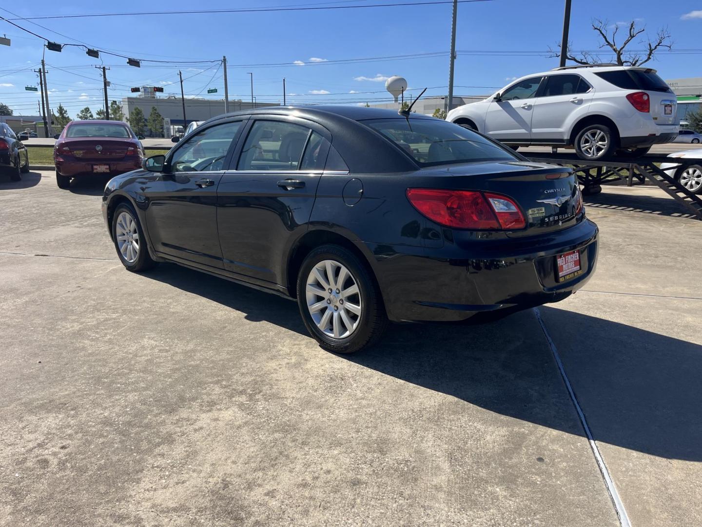 2010 Black /TAN Chrysler Sebring Sedan Limited (1C3CC5FB2AN) with an 2.4L L4 DOHC 16V engine, 4-Speed Automatic transmission, located at 14700 Tomball Parkway 249, Houston, TX, 77086, (281) 444-2200, 29.928619, -95.504074 - Photo#4