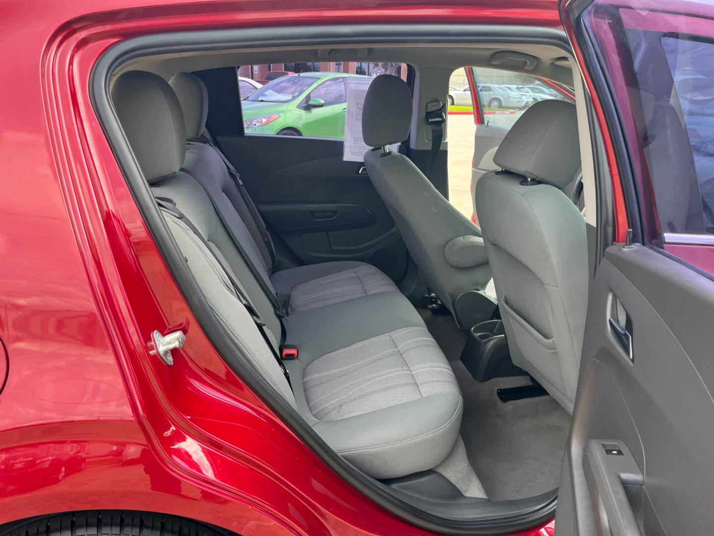 2013 red /black Chevrolet Sonic LT Auto 5-Door (1G1JC6SH3D4) with an 1.8L L4 DOHC 24V FFV engine, 6-Speed Automatic transmission, located at 14700 Tomball Parkway 249, Houston, TX, 77086, (281) 444-2200, 29.928619, -95.504074 - Photo#12