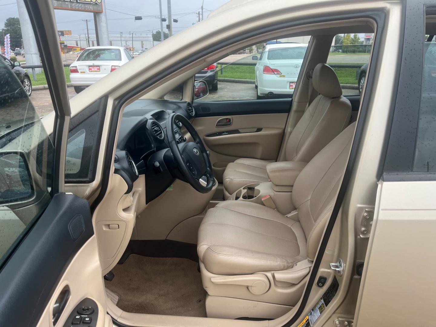 2007 GOLD /TAN Kia Rondo EX V6 (KNAFG526777) with an 2.7L V6 DOHC 24V engine, 4-Speed Automatic Overdrive transmission, located at 14700 Tomball Parkway 249, Houston, TX, 77086, (281) 444-2200, 29.928619, -95.504074 - Photo#8