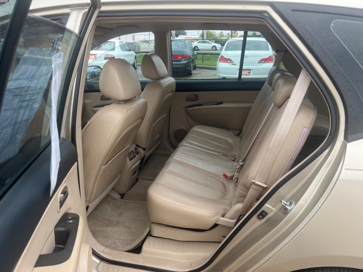2007 GOLD /TAN Kia Rondo EX V6 (KNAFG526777) with an 2.7L V6 DOHC 24V engine, 4-Speed Automatic Overdrive transmission, located at 14700 Tomball Parkway 249, Houston, TX, 77086, (281) 444-2200, 29.928619, -95.504074 - Photo#9