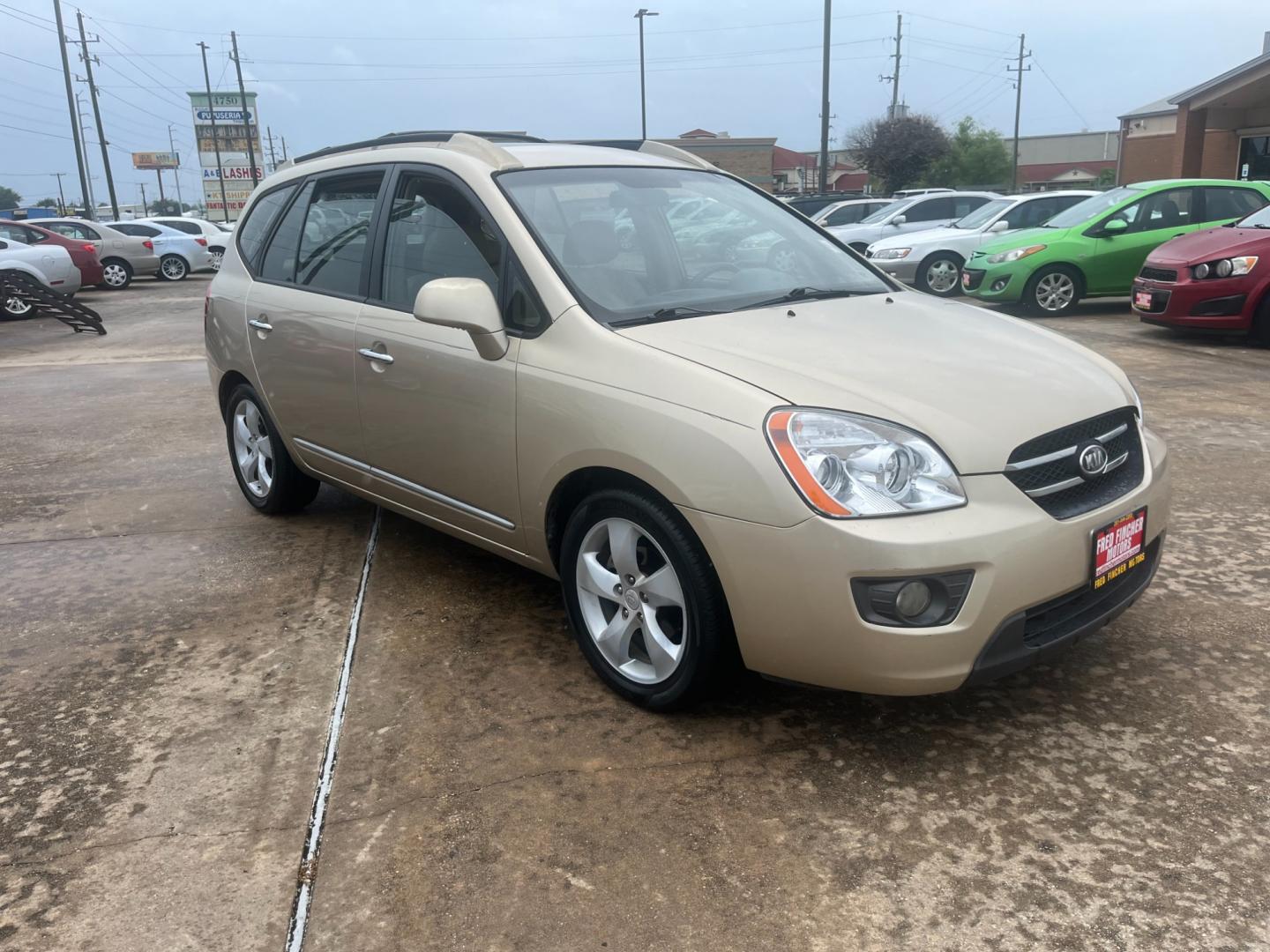 2007 GOLD /TAN Kia Rondo EX V6 (KNAFG526777) with an 2.7L V6 DOHC 24V engine, 4-Speed Automatic Overdrive transmission, located at 14700 Tomball Parkway 249, Houston, TX, 77086, (281) 444-2200, 29.928619, -95.504074 - Photo#0