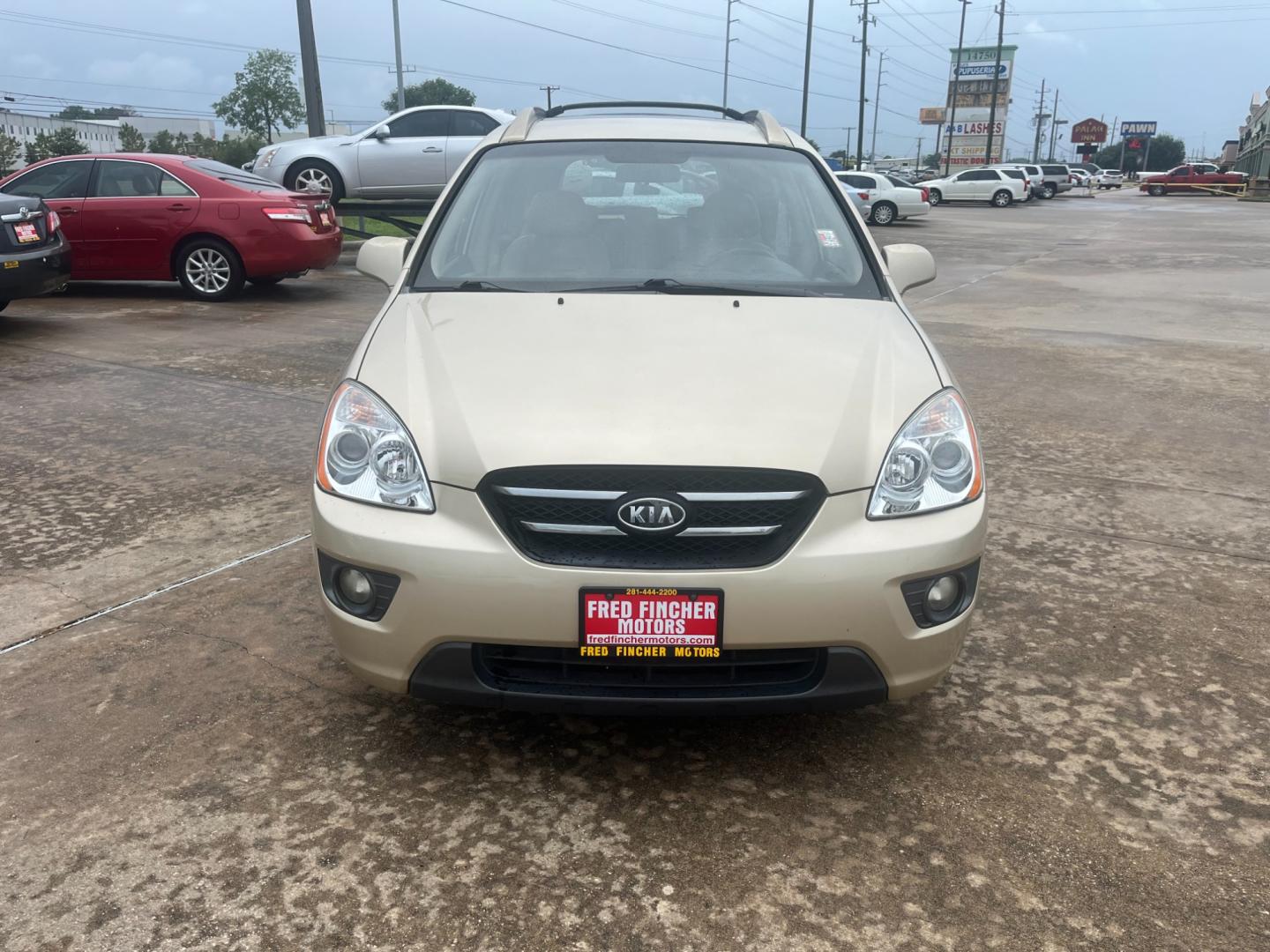 2007 GOLD /TAN Kia Rondo EX V6 (KNAFG526777) with an 2.7L V6 DOHC 24V engine, 4-Speed Automatic Overdrive transmission, located at 14700 Tomball Parkway 249, Houston, TX, 77086, (281) 444-2200, 29.928619, -95.504074 - Photo#1