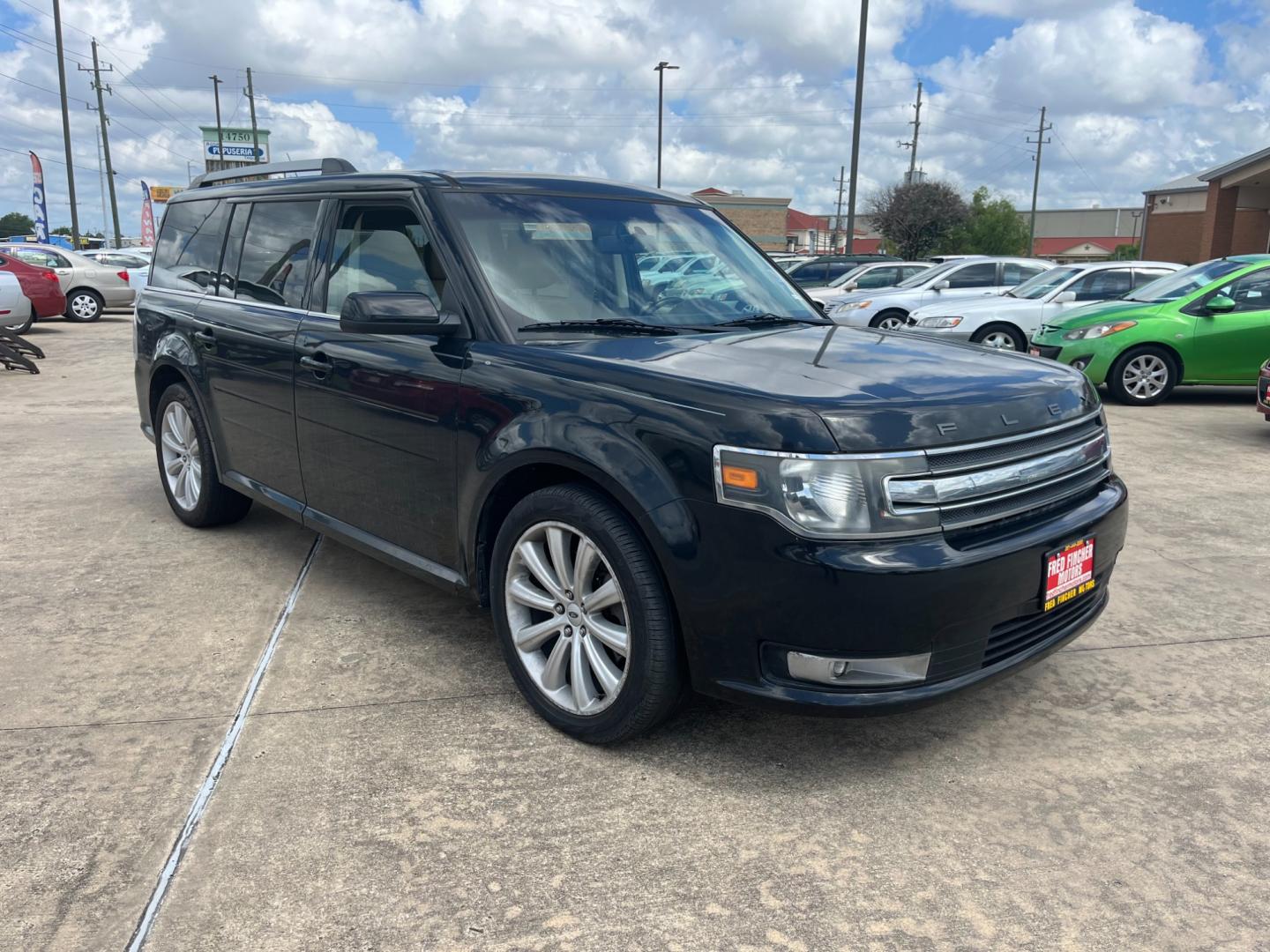 2013 Black /TAN Ford Flex (2FMGK5C87DB) , Automatic transmission, located at 14700 Tomball Parkway 249, Houston, TX, 77086, (281) 444-2200, 29.928619, -95.504074 - Photo#0