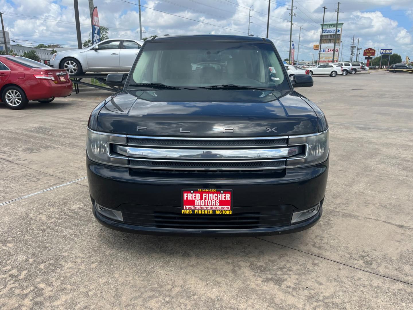 2013 Black /TAN Ford Flex (2FMGK5C87DB) , Automatic transmission, located at 14700 Tomball Parkway 249, Houston, TX, 77086, (281) 444-2200, 29.928619, -95.504074 - Photo#1