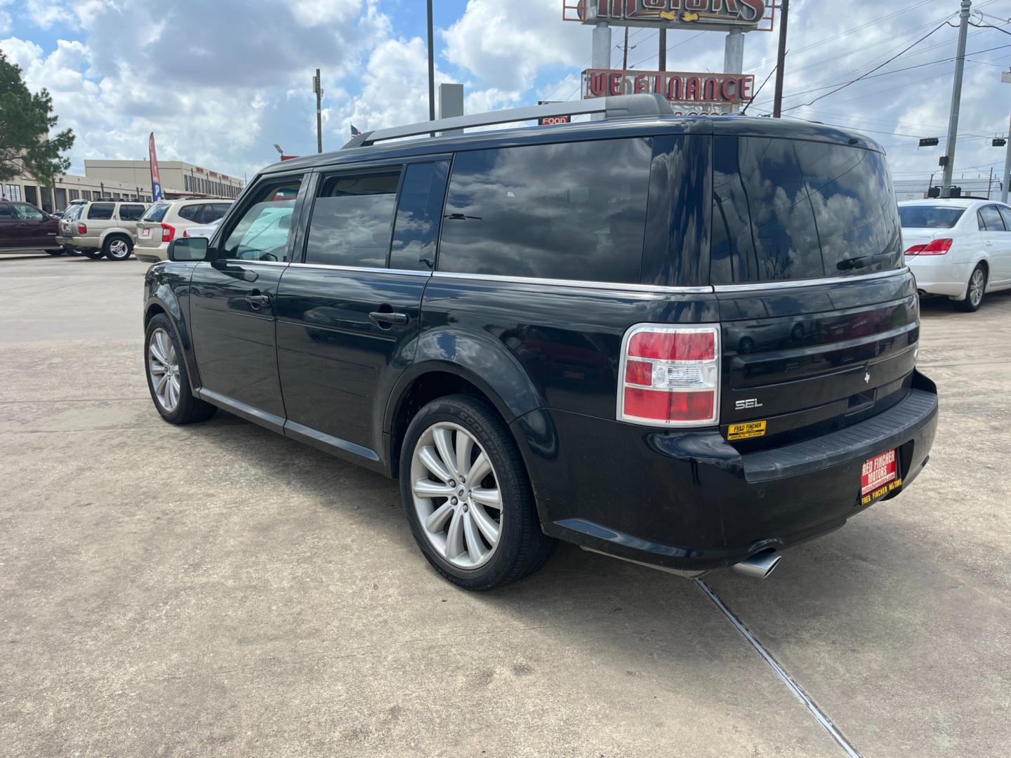 2013 Black /TAN Ford Flex (2FMGK5C87DB) , Automatic transmission, located at 14700 Tomball Parkway 249, Houston, TX, 77086, (281) 444-2200, 29.928619, -95.504074 - Photo#4