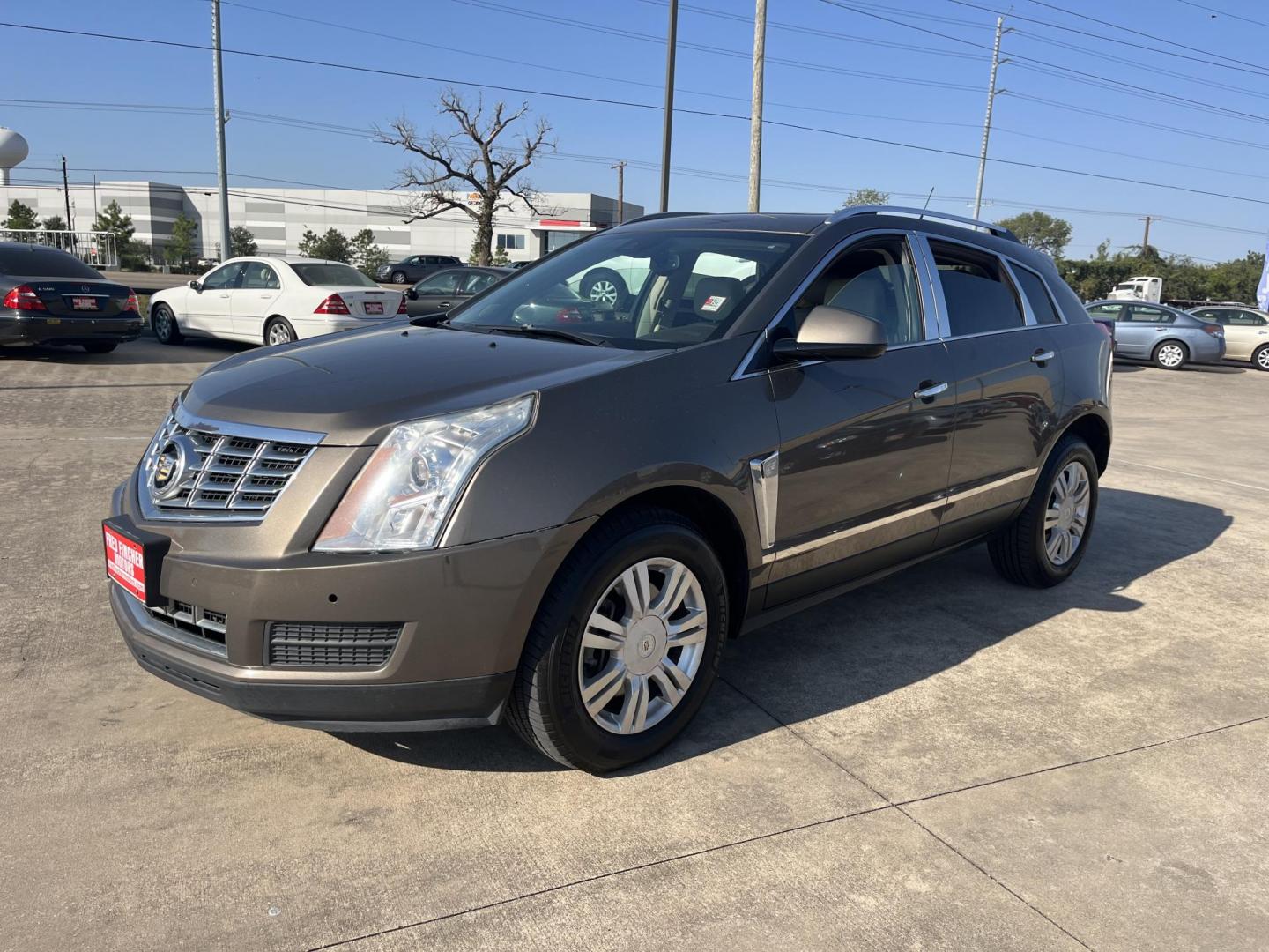 2014 Cadillac SRX Luxury Collection FWD (3GYFNBE30ES) with an 3.6L V6 DOHC 24V FFV engine, 6-Speed Automatic transmission, located at 14700 Tomball Parkway 249, Houston, TX, 77086, (281) 444-2200, 29.928619, -95.504074 - Photo#1