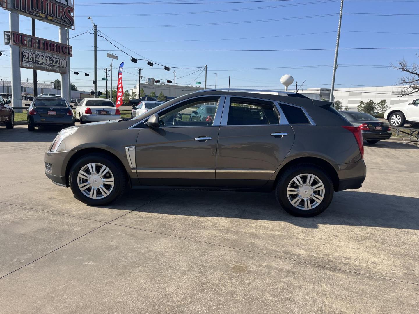 2014 Cadillac SRX Luxury Collection FWD (3GYFNBE30ES) with an 3.6L V6 DOHC 24V FFV engine, 6-Speed Automatic transmission, located at 14700 Tomball Parkway 249, Houston, TX, 77086, (281) 444-2200, 29.928619, -95.504074 - Photo#2