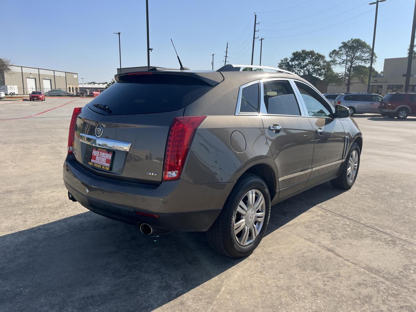 2014 Cadillac SRX Luxury Collection FWD (3GYFNBE30ES) with an 3.6L V6 DOHC 24V FFV engine, 6-Speed Automatic transmission, located at 14700 Tomball Parkway 249, Houston, TX, 77086, (281) 444-2200, 29.928619, -95.504074 - Photo#7