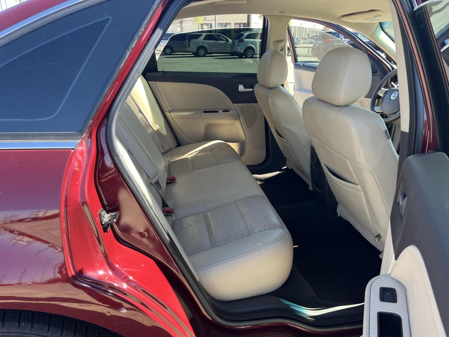 2008 maroom /TAN Mercury Sable Premier (1MEHM42W68G) with an 3.5L V6 DOHC 24V engine, 6-Speed Automatic Overdrive transmission, located at 14700 Tomball Parkway 249, Houston, TX, 77086, (281) 444-2200, 29.928619, -95.504074 - Photo#12