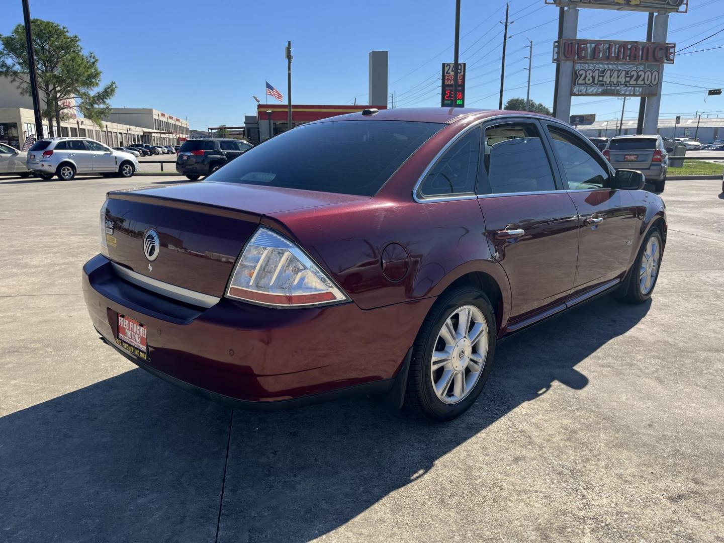 2008 maroom /TAN Mercury Sable Premier (1MEHM42W68G) with an 3.5L V6 DOHC 24V engine, 6-Speed Automatic Overdrive transmission, located at 14700 Tomball Parkway 249, Houston, TX, 77086, (281) 444-2200, 29.928619, -95.504074 - Photo#5
