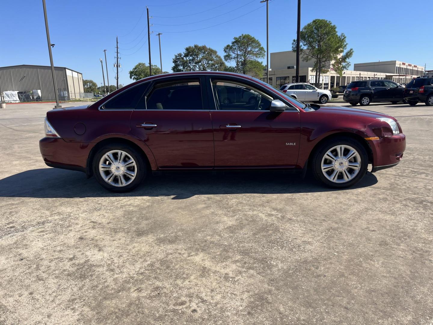 2008 maroom /TAN Mercury Sable Premier (1MEHM42W68G) with an 3.5L V6 DOHC 24V engine, 6-Speed Automatic Overdrive transmission, located at 14700 Tomball Parkway 249, Houston, TX, 77086, (281) 444-2200, 29.928619, -95.504074 - Photo#7