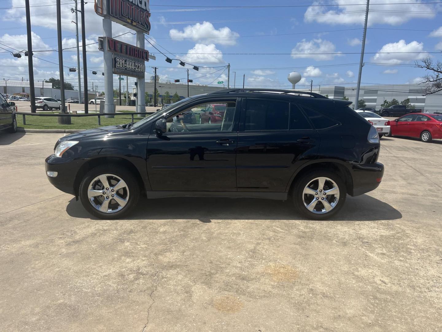 2009 black /TAN Lexus RX 350 FWD (2T2GK31U89C) with an 3.5L V6 DOHC 24V engine, 5-Speed Automatic Overdrive transmission, located at 14700 Tomball Parkway 249, Houston, TX, 77086, (281) 444-2200, 29.928619, -95.504074 - Photo#3