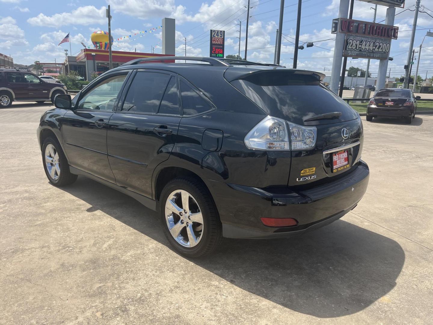 2009 black /TAN Lexus RX 350 FWD (2T2GK31U89C) with an 3.5L V6 DOHC 24V engine, 5-Speed Automatic Overdrive transmission, located at 14700 Tomball Parkway 249, Houston, TX, 77086, (281) 444-2200, 29.928619, -95.504074 - Photo#4