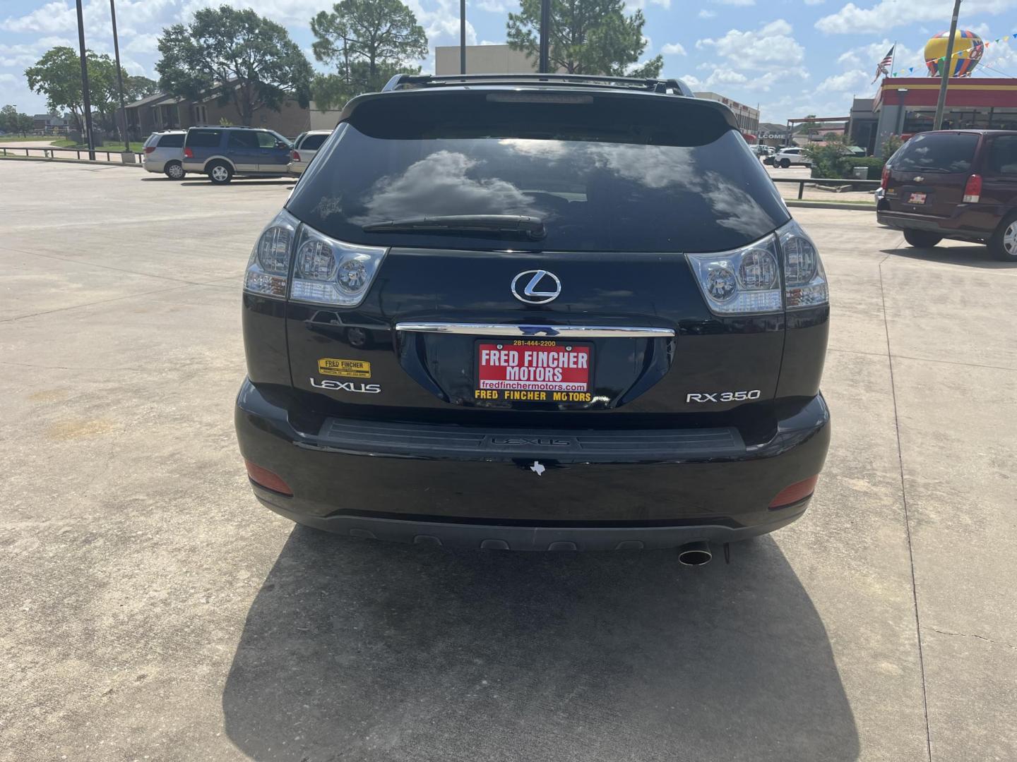2009 black /TAN Lexus RX 350 FWD (2T2GK31U89C) with an 3.5L V6 DOHC 24V engine, 5-Speed Automatic Overdrive transmission, located at 14700 Tomball Parkway 249, Houston, TX, 77086, (281) 444-2200, 29.928619, -95.504074 - Photo#5