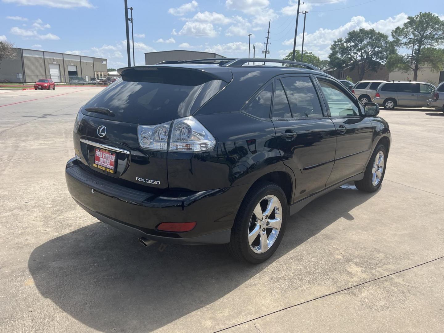 2009 black /TAN Lexus RX 350 FWD (2T2GK31U89C) with an 3.5L V6 DOHC 24V engine, 5-Speed Automatic Overdrive transmission, located at 14700 Tomball Parkway 249, Houston, TX, 77086, (281) 444-2200, 29.928619, -95.504074 - Photo#6