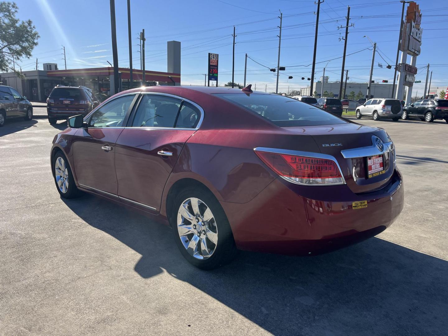 2010 red /tan Buick LaCrosse CXL FWD (1G4GC5EGXAF) with an 3.0L V6 DOHC 24V engine, 6-Speed Automatic Overdrive transmission, located at 14700 Tomball Parkway 249, Houston, TX, 77086, (281) 444-2200, 29.928619, -95.504074 - Photo#4