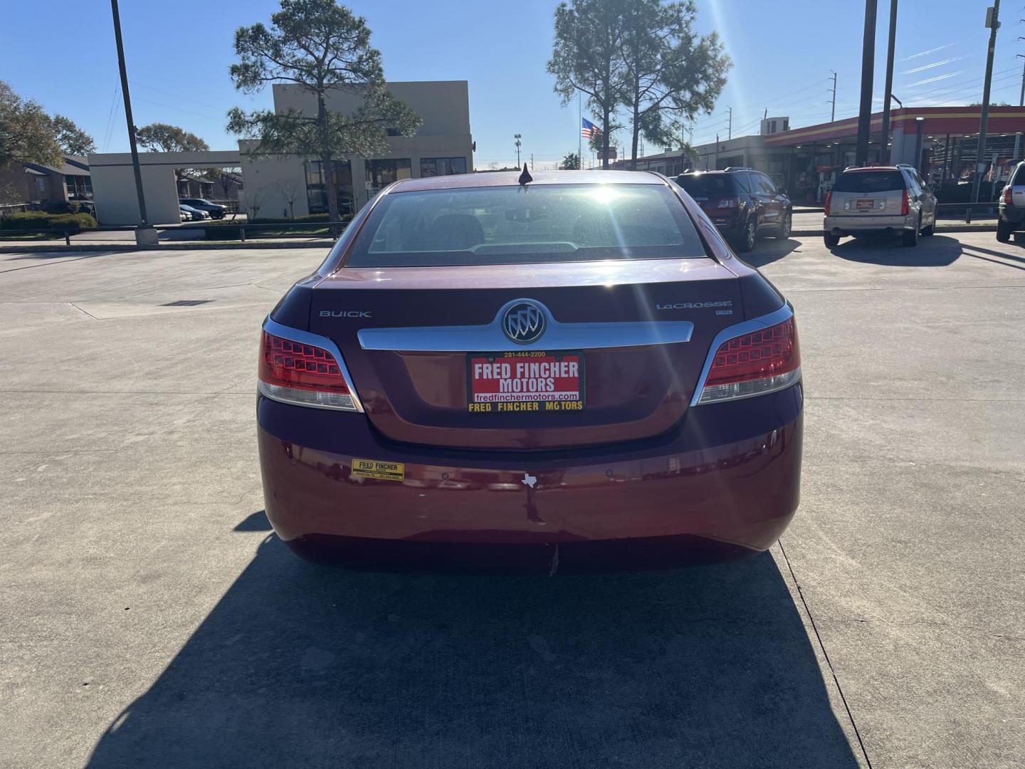 2010 red /tan Buick LaCrosse CXL FWD (1G4GC5EGXAF) with an 3.0L V6 DOHC 24V engine, 6-Speed Automatic Overdrive transmission, located at 14700 Tomball Parkway 249, Houston, TX, 77086, (281) 444-2200, 29.928619, -95.504074 - Photo#5