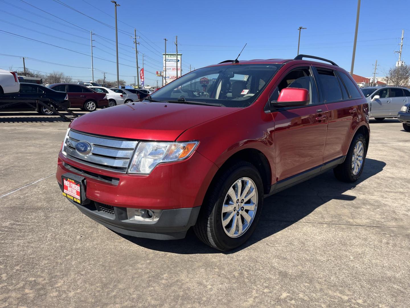 2010 red /black Ford Edge SEL FWD (2FMDK3JC3AB) with an 3.5L V6 DOHC 24V engine, 6-Speed Automatic transmission, located at 14700 Tomball Parkway 249, Houston, TX, 77086, (281) 444-2200, 29.928619, -95.504074 - Photo#2