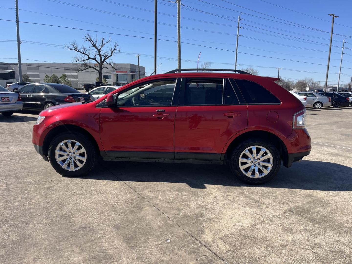 2010 red /black Ford Edge SEL FWD (2FMDK3JC3AB) with an 3.5L V6 DOHC 24V engine, 6-Speed Automatic transmission, located at 14700 Tomball Parkway 249, Houston, TX, 77086, (281) 444-2200, 29.928619, -95.504074 - Photo#3