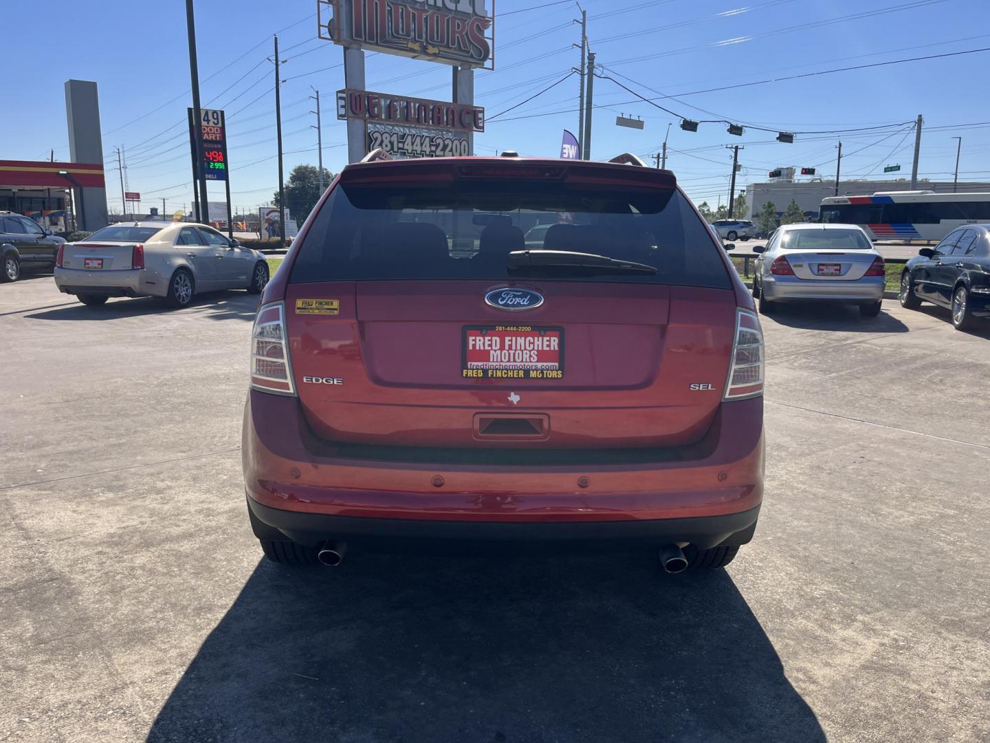 2010 red /black Ford Edge SEL FWD (2FMDK3JC3AB) with an 3.5L V6 DOHC 24V engine, 6-Speed Automatic transmission, located at 14700 Tomball Parkway 249, Houston, TX, 77086, (281) 444-2200, 29.928619, -95.504074 - Photo#4
