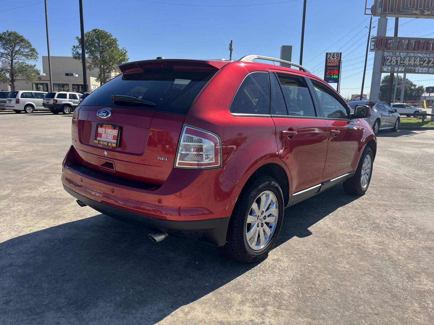 2010 red /black Ford Edge SEL FWD (2FMDK3JC3AB) with an 3.5L V6 DOHC 24V engine, 6-Speed Automatic transmission, located at 14700 Tomball Parkway 249, Houston, TX, 77086, (281) 444-2200, 29.928619, -95.504074 - Photo#6