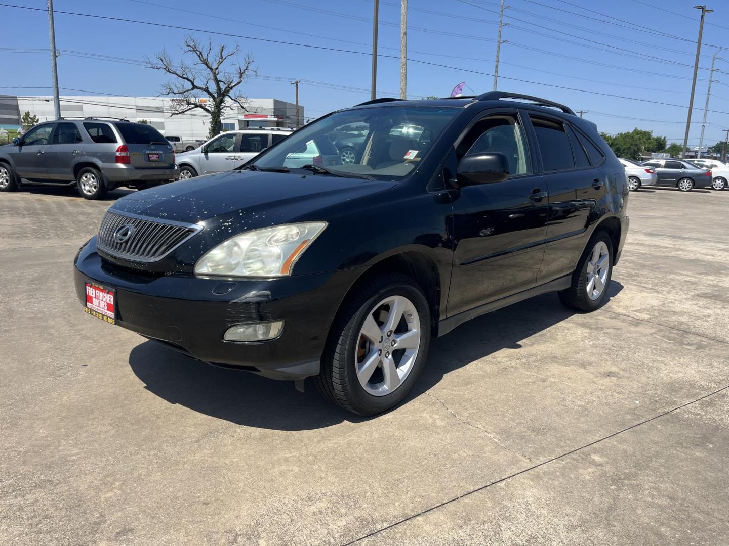 2007 black /gray Lexus RX 350 FWD (2T2GK31U27C) with an 3.5L V6 DOHC 24V engine, 5-Speed Automatic Overdrive transmission, located at 14700 Tomball Parkway 249, Houston, TX, 77086, (281) 444-2200, 29.928619, -95.504074 - Photo#2