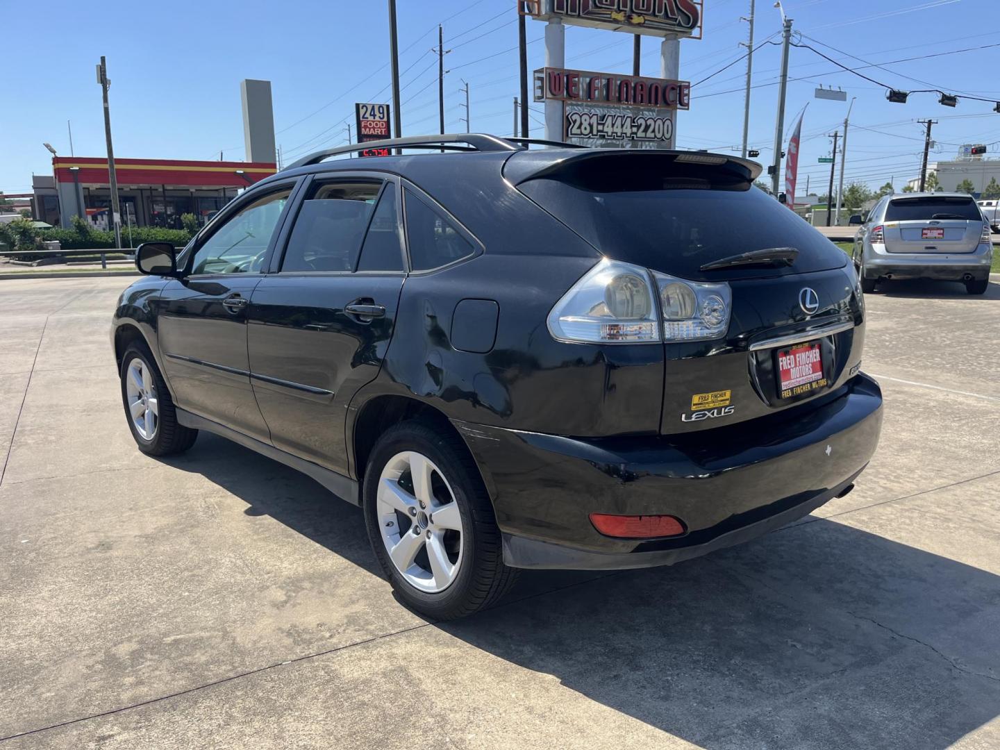 2007 black /gray Lexus RX 350 FWD (2T2GK31U27C) with an 3.5L V6 DOHC 24V engine, 5-Speed Automatic Overdrive transmission, located at 14700 Tomball Parkway 249, Houston, TX, 77086, (281) 444-2200, 29.928619, -95.504074 - Photo#4