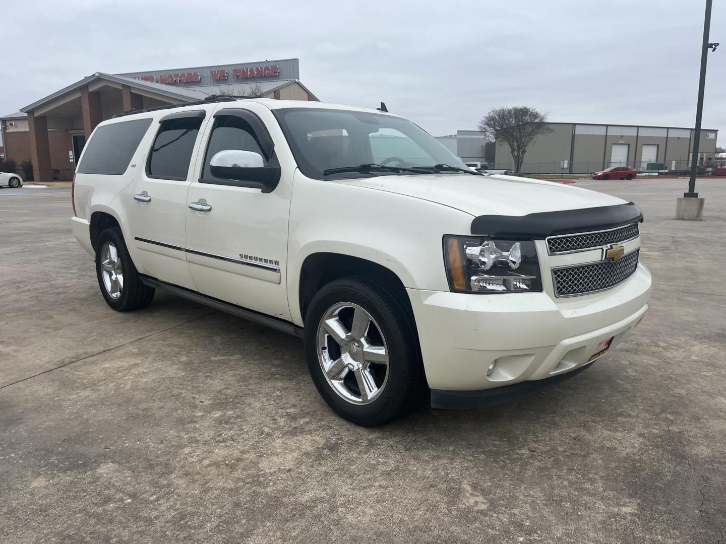 2011 white /black Chevrolet Suburban LTZ 1500 4WD (1GNSKKE37BR) with an 5.3L V8 OHV 16V FFV engine, 4-Speed Automatic transmission, located at 14700 Tomball Parkway 249, Houston, TX, 77086, (281) 444-2200, 29.928619, -95.504074 - Photo#0