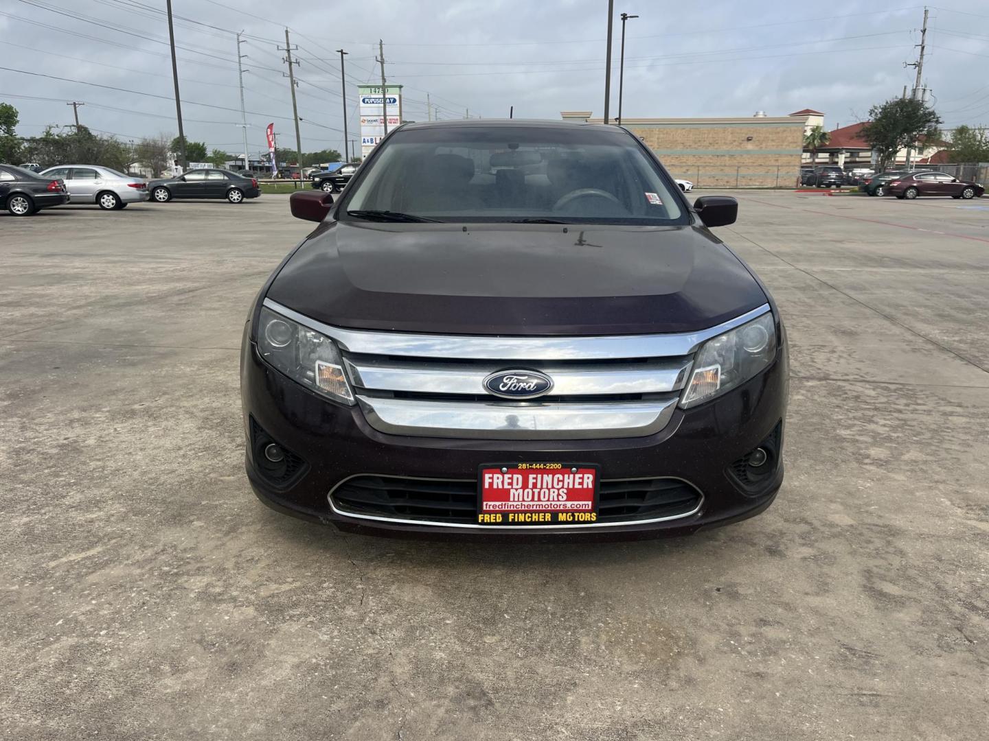 2012 purple /TAN Ford Fusion SE (3FAHP0HA5CR) with an 2.5L L4 DOHC 16V engine, Automatic Overdrive transmission, located at 14700 Tomball Parkway 249, Houston, TX, 77086, (281) 444-2200, 29.928619, -95.504074 - Photo#1