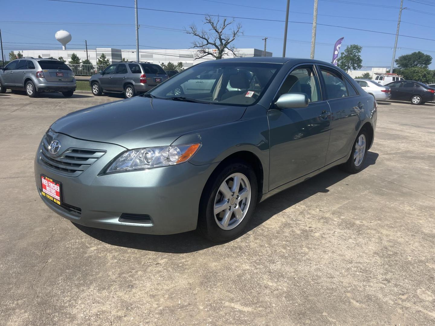 2007 Green /Gray Toyota Camry CE 5-Spd AT (4T1BE46K47U) with an 2.4L L4 DOHC 16V engine, 5-Speed Automatic Overdrive transmission, located at 14700 Tomball Parkway 249, Houston, TX, 77086, (281) 444-2200, 29.928619, -95.504074 - Photo#2