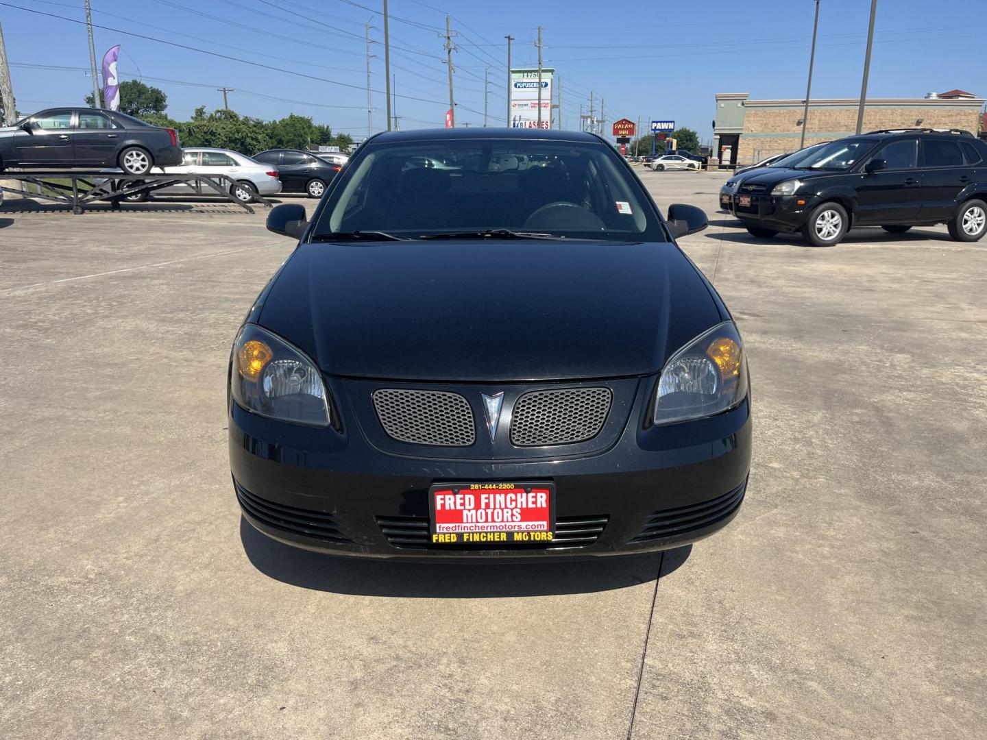 2009 black /Black Pontiac G5 Coupe (1G2AL18H097) with an 2.2L L4 DOHC 16V engine, 5-Speed Manual transmission, located at 14700 Tomball Parkway 249, Houston, TX, 77086, (281) 444-2200, 29.928619, -95.504074 - Photo#1